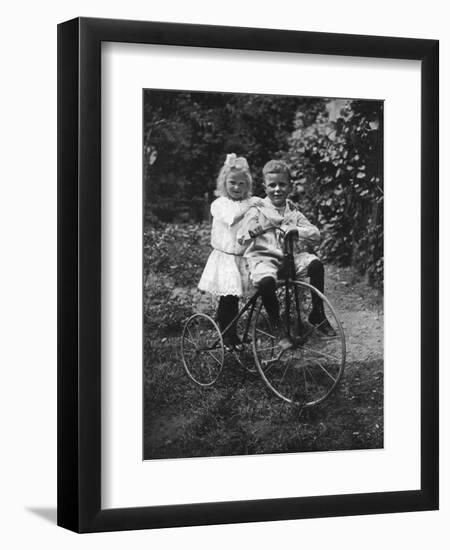 Two Children on a Tricycle, 1911-1912-CW Perry-Framed Giclee Print