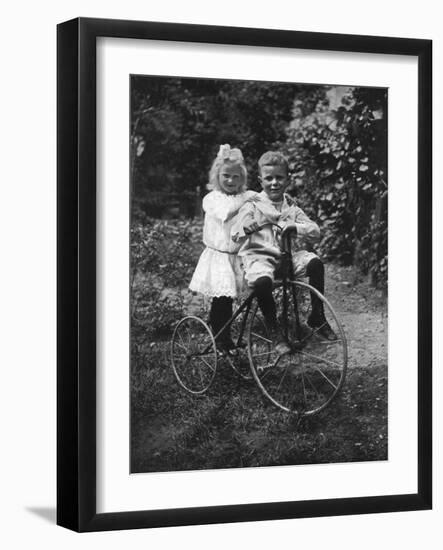 Two Children on a Tricycle, 1911-1912-CW Perry-Framed Giclee Print