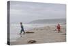 Two Children Playing on a Beach-Clive Nolan-Stretched Canvas