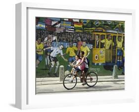 Two Children Ride Their Bicycle Pass a Mural-null-Framed Photographic Print