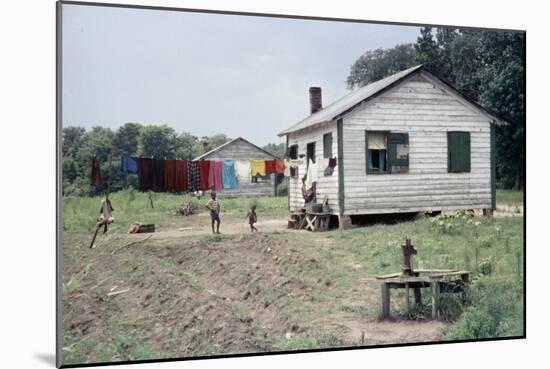 Two Children Stand in a Yard under a Laundry Line, Edisto Island, South Carolina, 1956-Walter Sanders-Mounted Photographic Print