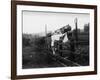 Two Children Stand on a Fence and Wave a Handkerchief at a Passing Steam Train-Staniland Pugh-Framed Photographic Print