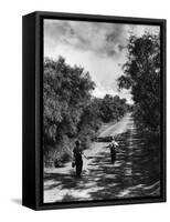 Two Children Walking Down a Dirt Road Going Fishing on a Summer Day-John Dominis-Framed Stretched Canvas