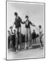 Two Clowns on Stilts Assisted by Girls in Bathing Costumes at Ramsgate Kent England-null-Mounted Art Print