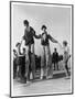 Two Clowns on Stilts Assisted by Girls in Bathing Costumes at Ramsgate Kent England-null-Mounted Art Print