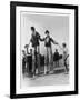 Two Clowns on Stilts Assisted by Girls in Bathing Costumes at Ramsgate Kent England-null-Framed Art Print