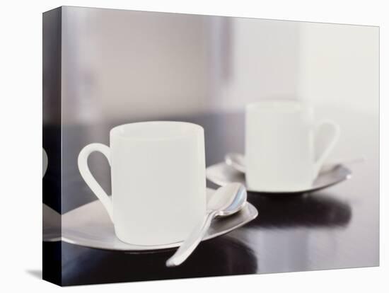 Two coffee cups on a table-null-Stretched Canvas