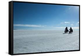 Two Cyclists Cycle in the Morning over the Salar De Uyuni-Alex Saberi-Framed Stretched Canvas