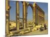 Two Cyclists Pass the Great Colonnade (Cardo), Palmyra, Unesco World Heritage Site, Syria-Eitan Simanor-Mounted Photographic Print