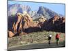 Two Cyclists Ride Along the 13-Mile-Long Scenic Drive-null-Mounted Photographic Print