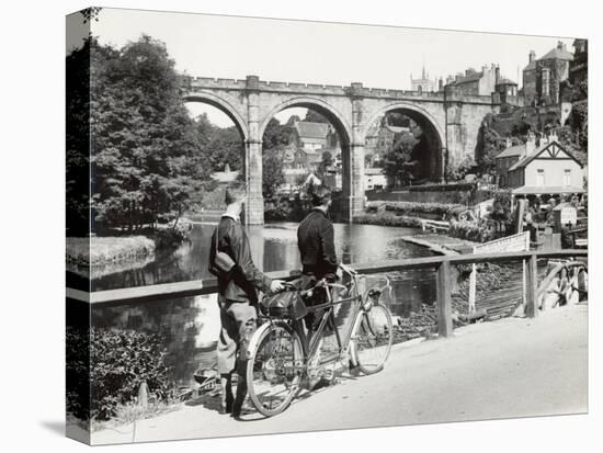 Two Cyclists Take a Break on a Bridge Over the River Nidd at Knaresborough-Fred Musto-Stretched Canvas