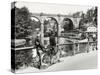 Two Cyclists Take a Break on a Bridge Over the River Nidd at Knaresborough-Fred Musto-Stretched Canvas