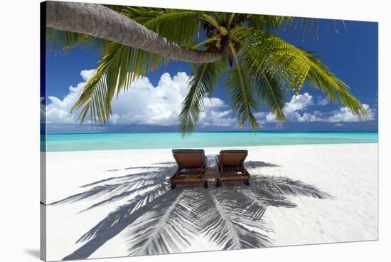 Two deck chairs under palm trees and tropical beach, The Maldives, Indian Ocean, Asia-Sakis Papadopoulos-Stretched Canvas