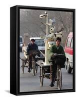 Two Delivery Riders Carry a Dentists Drill and Chair Along a Beijing Street January 4-null-Framed Stretched Canvas