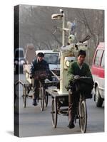 Two Delivery Riders Carry a Dentists Drill and Chair Along a Beijing Street January 4-null-Stretched Canvas