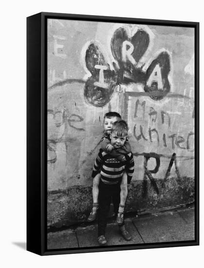 Two Dirty Boys Stand in Front of Ira Graffiti in Northern Ireland-null-Framed Stretched Canvas