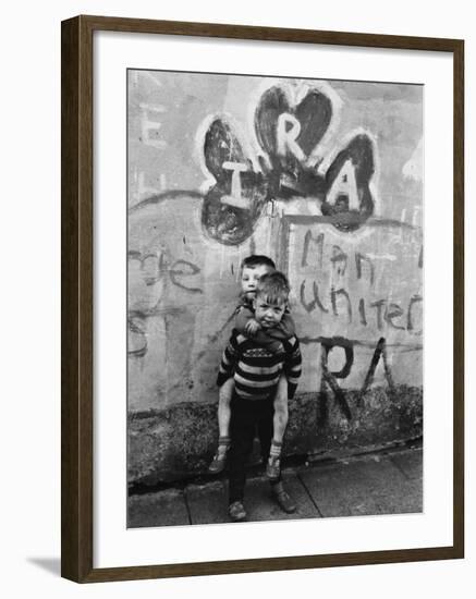 Two Dirty Boys Stand in Front of Ira Graffiti in Northern Ireland-null-Framed Photographic Print