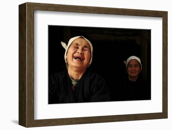 Two Dong Women, One Laughing, in a Dark Room, Sanjiang Dong Village, Guangxi, China-Enrique Lopez-Tapia-Framed Photographic Print