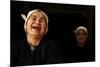 Two Dong Women, One Laughing, in a Dark Room, Sanjiang Dong Village, Guangxi, China-Enrique Lopez-Tapia-Mounted Photographic Print
