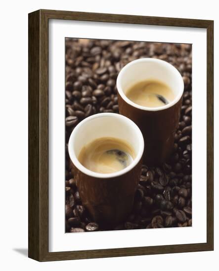 Two Espressos Standing on Coffee Beans-null-Framed Photographic Print
