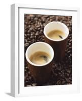 Two Espressos Standing on Coffee Beans-null-Framed Photographic Print