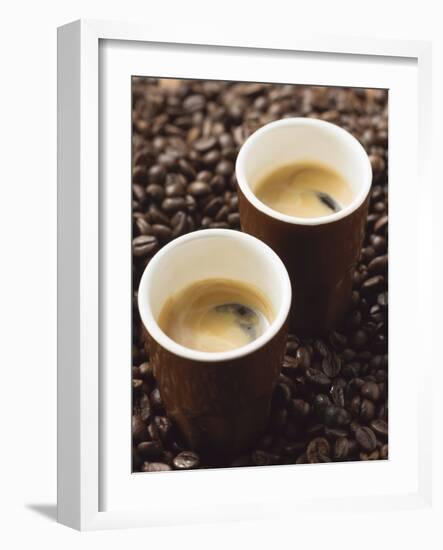 Two Espressos Standing on Coffee Beans-null-Framed Photographic Print