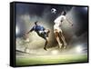 Two Football Players in Jump to Strike the Ball at the Stadium-Sergey Nivens-Framed Stretched Canvas