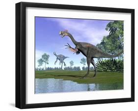 Two Gigantoraptor Dinosaurs in a Prehistoric Environment-null-Framed Art Print