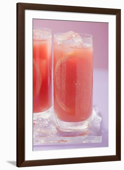 Two Glasses of Pink Grapefruit Juice with Ice Cubes-Foodcollection-Framed Photographic Print