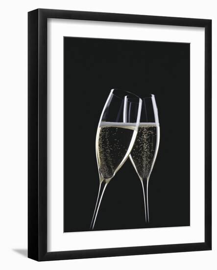 Two Glasses of Sparkling Wine Being Clinked Together-null-Framed Premium Photographic Print