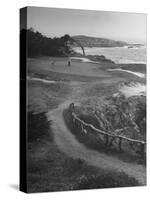 Two Golfers Playing on a Putting Green at Pebble Beach Golf Course-Nina Leen-Stretched Canvas