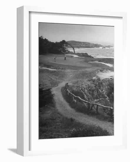 Two Golfers Playing on a Putting Green at Pebble Beach Golf Course-Nina Leen-Framed Photographic Print