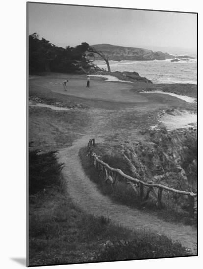 Two Golfers Playing on a Putting Green at Pebble Beach Golf Course-Nina Leen-Mounted Photographic Print