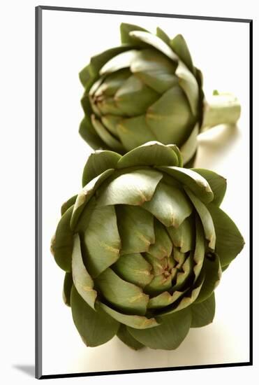 Two Green Artichokes-Alain Caste-Mounted Photographic Print