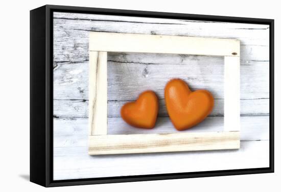 Two Hearts Made of Stone in Picture Frame-Uwe Merkel-Framed Stretched Canvas