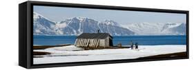 Two Hikers Standing on the Beach Near a Hunting Cabin, Bellsund, Spitsbergen, Svalbard Islands-null-Framed Stretched Canvas