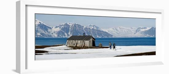 Two Hikers Standing on the Beach Near a Hunting Cabin, Bellsund, Spitsbergen, Svalbard Islands-null-Framed Photographic Print