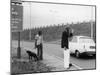 Two Hippy Hitch-Hikers, Thumbing a Lift, But Will Anyone Stop for Them?-null-Mounted Photographic Print