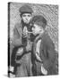 Two Homeless Boys Lighting Up American Cigarettes with British Matches-George Rodger-Stretched Canvas