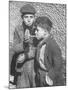 Two Homeless Boys Lighting Up American Cigarettes with British Matches-George Rodger-Mounted Photographic Print