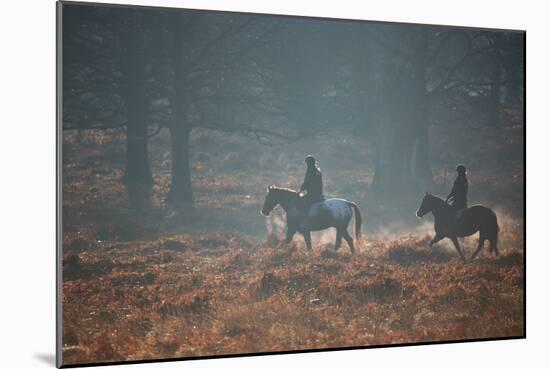 Two Horseback Riders Make their Way Through Misty Richmond Park in Winter-Alex Saberi-Mounted Photographic Print