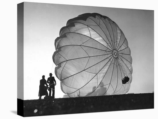 Two Irving Air Chute Co. Employees Struggling to Pull Down One of their Parachutes after Test Jump-Margaret Bourke-White-Stretched Canvas