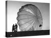 Two Irving Air Chute Co. Employees Struggling to Pull Down One of their Parachutes after Test Jump-Margaret Bourke-White-Stretched Canvas