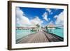 Two Kids Walking towards over the Water Bungalowas-BlueOrange Studio-Framed Photographic Print