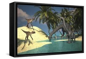 Two Large Brachiosaurus Grazing in Shallow Waters as Two Utahraptors Approach-null-Framed Stretched Canvas