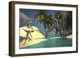 Two Large Brachiosaurus Grazing in Shallow Waters as Two Utahraptors Approach-null-Framed Art Print