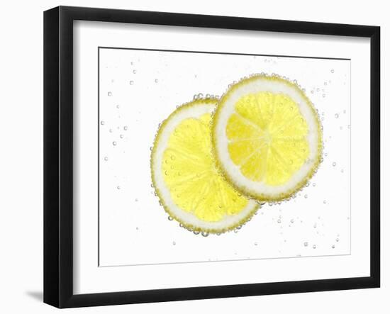 Two Lemon Slices in Water with Air Bubbles-Kröger & Gross-Framed Photographic Print