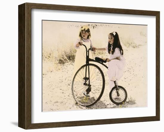 Two Little Girls by an Old Fashioned Bicycle-Nora Hernandez-Framed Giclee Print