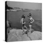 Two Little Girls Modelling Sun Dot Bathing Suits While Playing on the Rocks-Nina Leen-Stretched Canvas