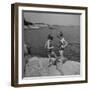 Two Little Girls Modelling Sun Dot Bathing Suits While Playing on the Rocks-Nina Leen-Framed Photographic Print